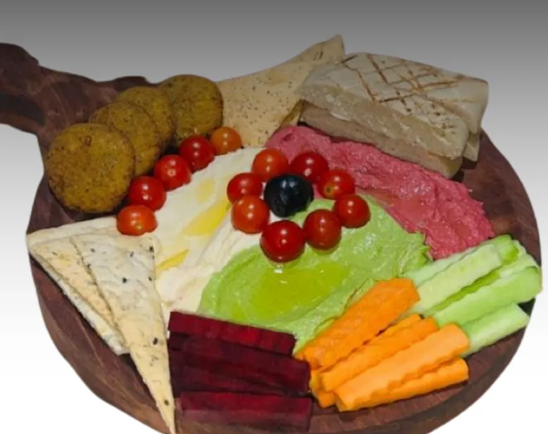 Mezze board with falafel, hummus, pita and crudités